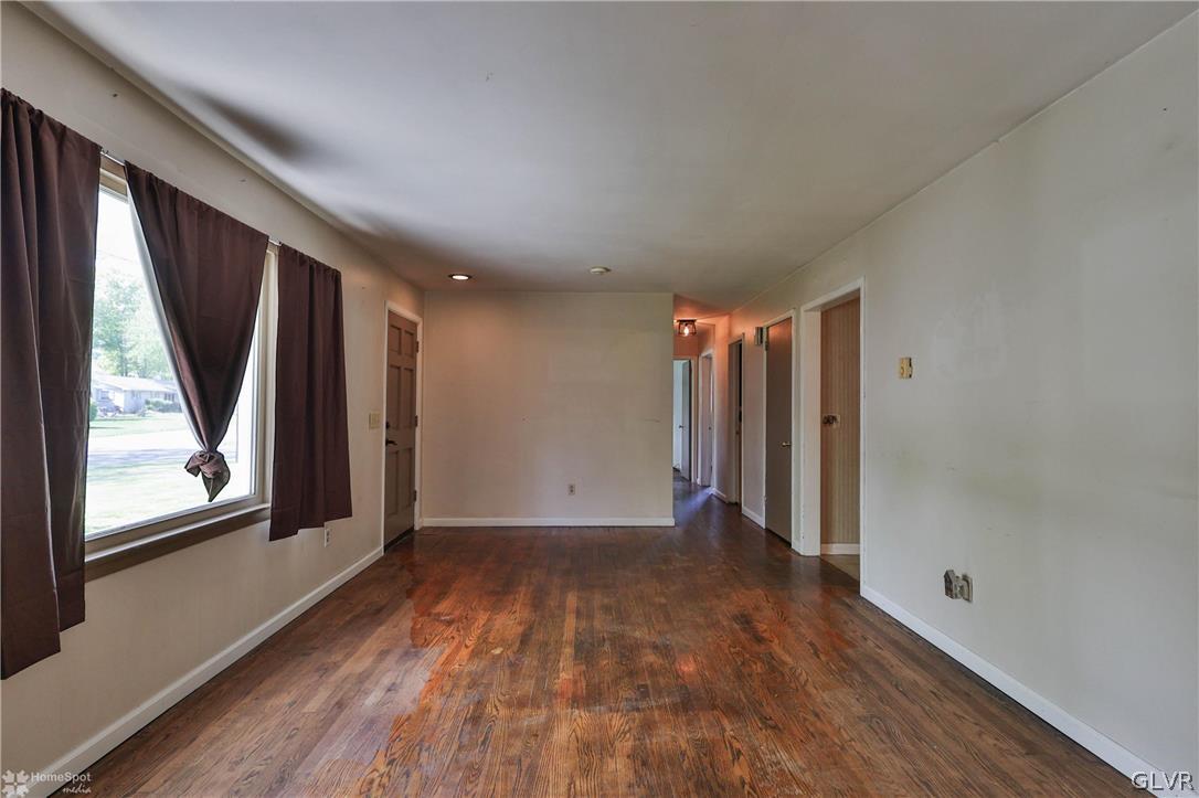 1034 Pine Tree Drive Slatington, PA 18080 - Photo 7 of 46 a view of a room with wooden floor and window
