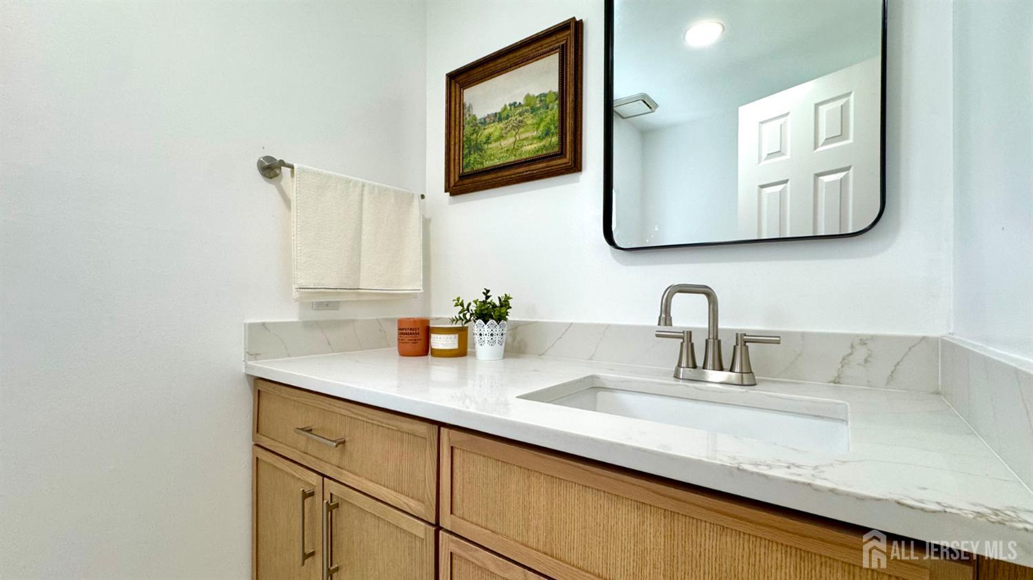507 Timber Oaks Road Edison, NJ 08820 - Photo 9 of 17 a bathroom with a sink and a mirror
