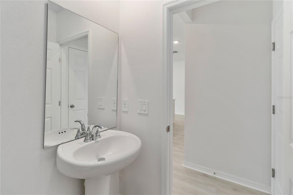 4569 Range Land Way St. Cloud, FL 34772 - Photo 14 of 41 a bathroom with a sink and a mirror