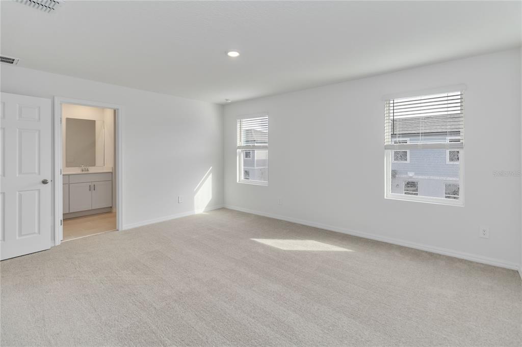 4569 Range Land Way St. Cloud, FL 34772 - Photo 17 of 41 a view of an empty room with windows