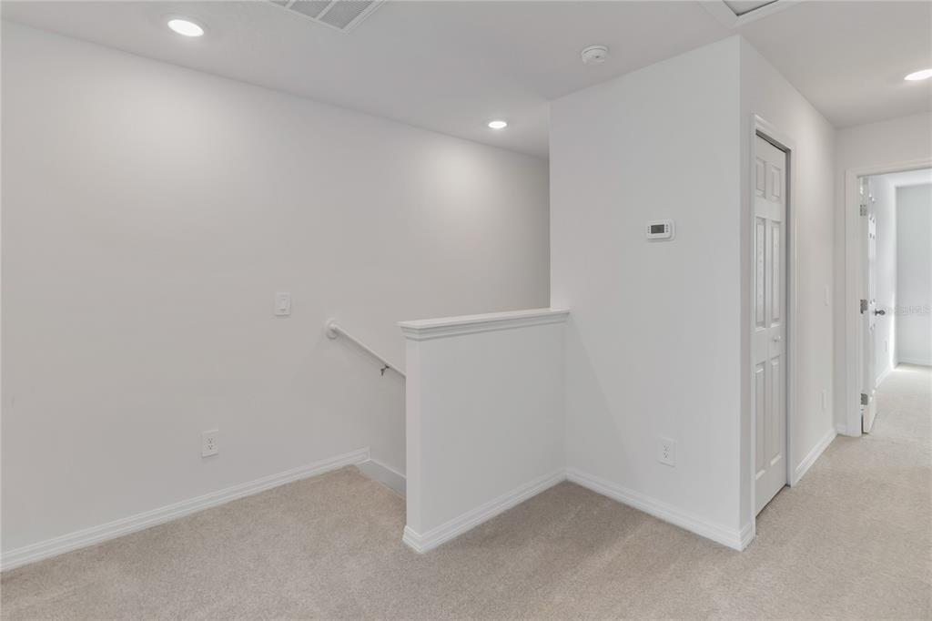 4569 Range Land Way St. Cloud, FL 34772 - Photo 19 of 41 an empty room with a workbench