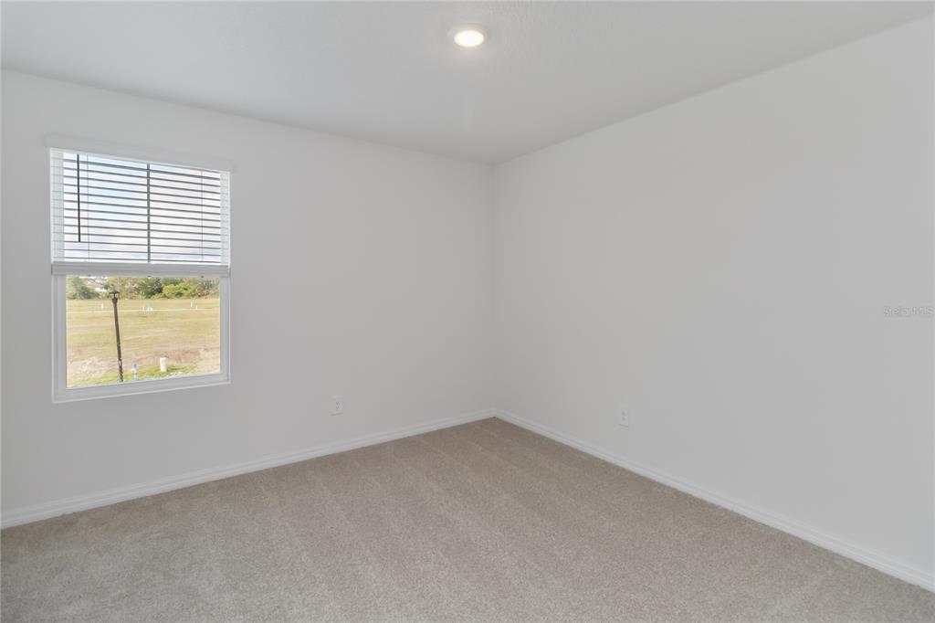 4569 Range Land Way St. Cloud, FL 34772 - Photo 20 of 41 an empty room with a window