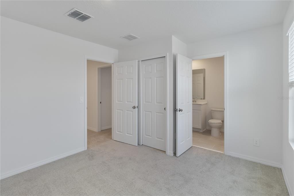 4569 Range Land Way St. Cloud, FL 34772 - Photo 23 of 41 a view of an empty room and a bathroom