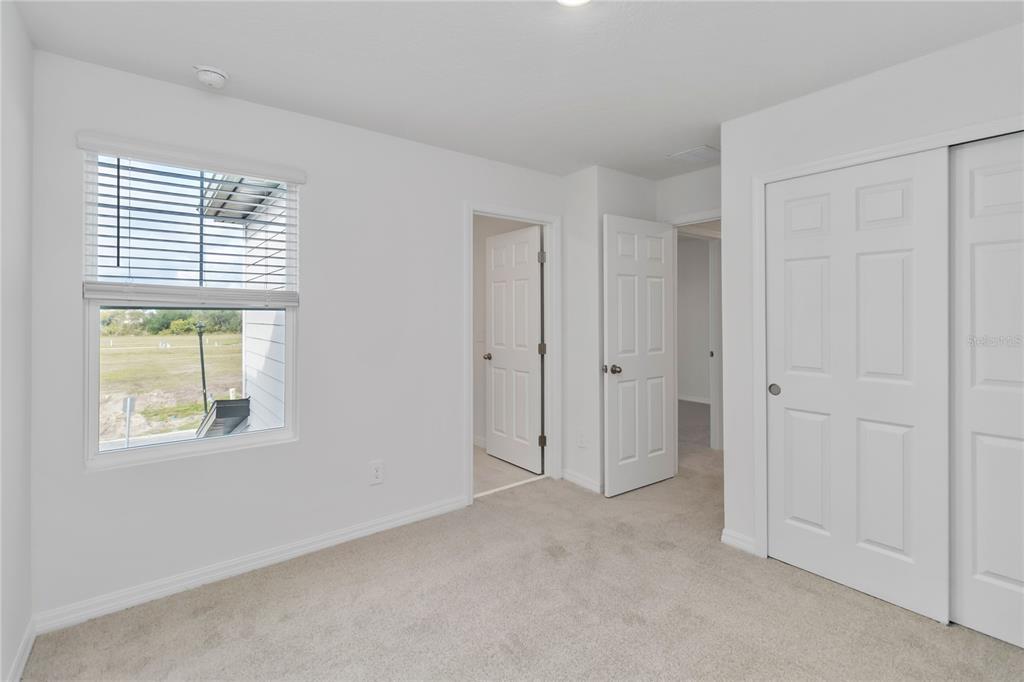 4569 Range Land Way St. Cloud, FL 34772 - Photo 24 of 41 a view of an empty room with a window