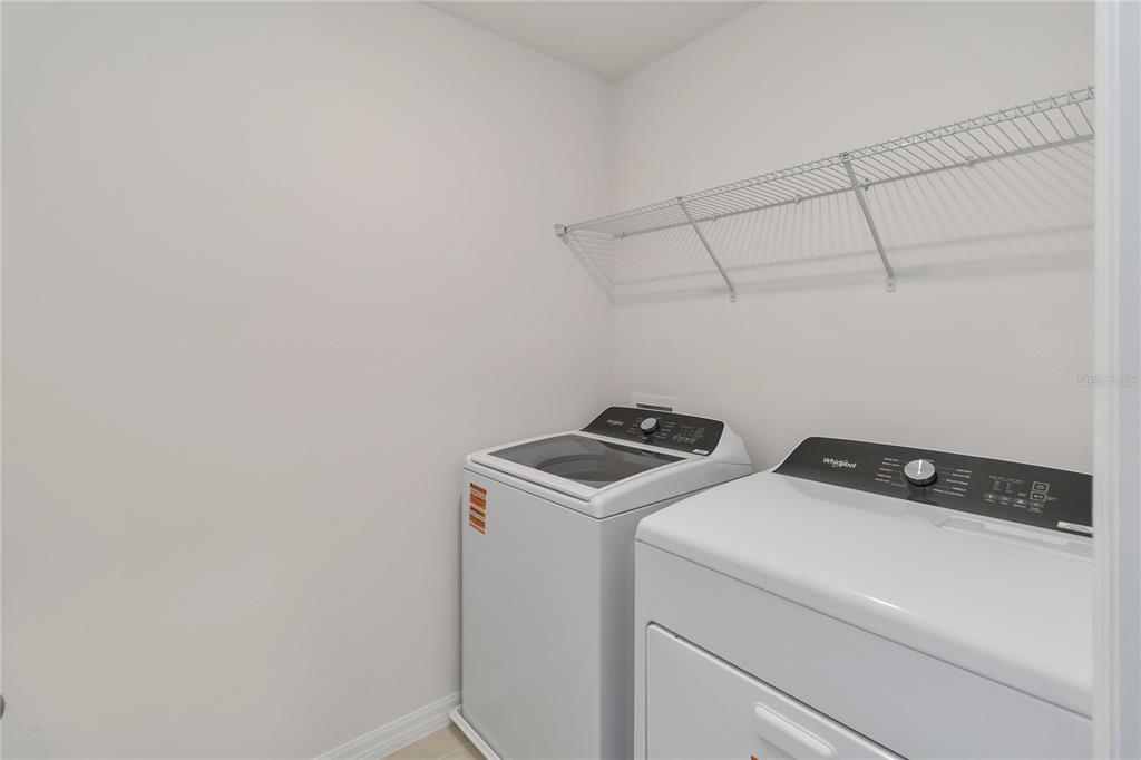 4569 Range Land Way St. Cloud, FL 34772 - Photo 26 of 41 a utility room with dryer and washer