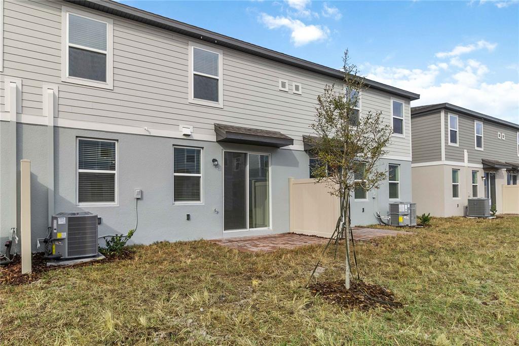 4569 Range Land Way St. Cloud, FL 34772 - Photo 27 of 41 a front view of a house with a yard