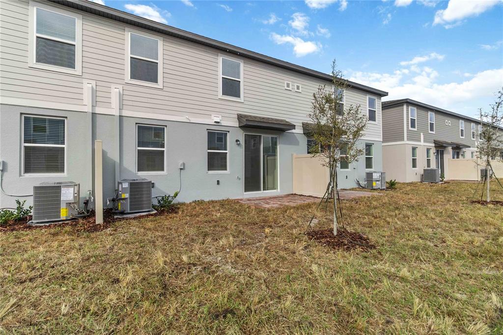 4569 Range Land Way St. Cloud, FL 34772 - Photo 29 of 41 a house with trees in front of it