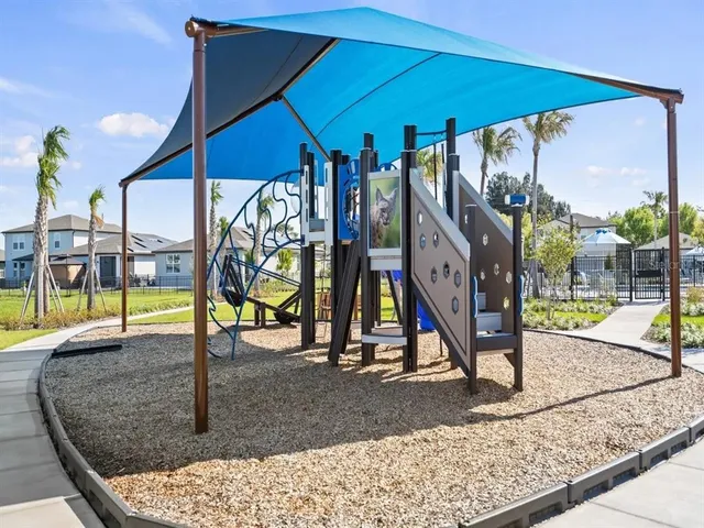 a view of a swimming pool with an outdoor seating