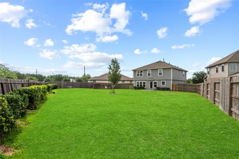 a view of a house with a big yard