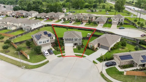 an aerial view of a house with a swimming pool
