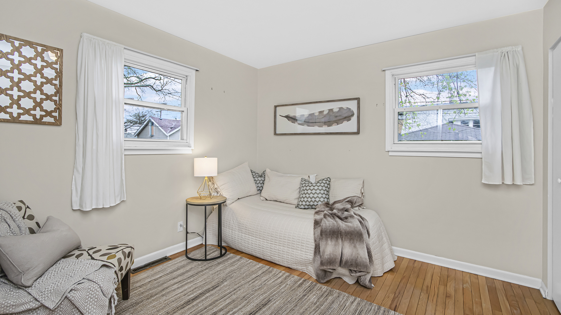 1622 Dempster Street Evanston, IL 60202 - Photo 12 of 21 a bedroom with a bed and a painting on the wall
