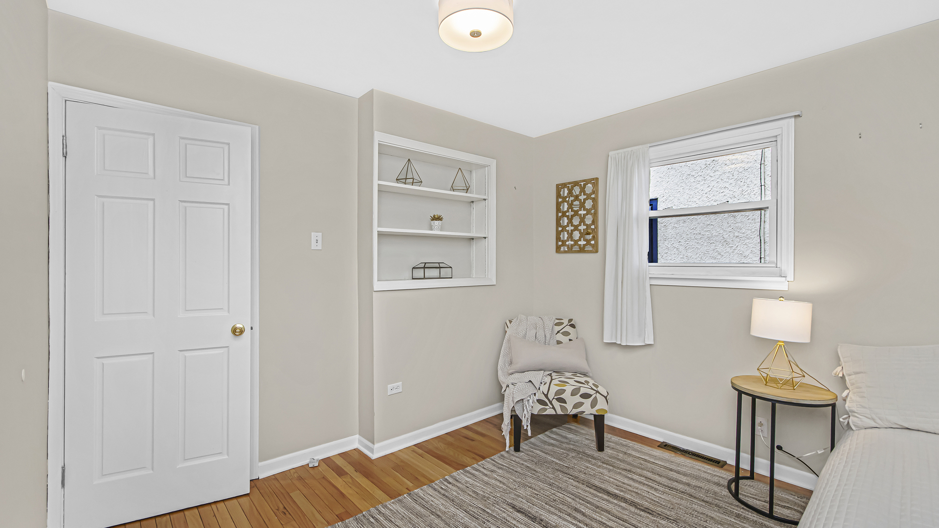 1622 Dempster Street Evanston, IL 60202 - Photo 13 of 21 a view of a livingroom with wooden floor and a window