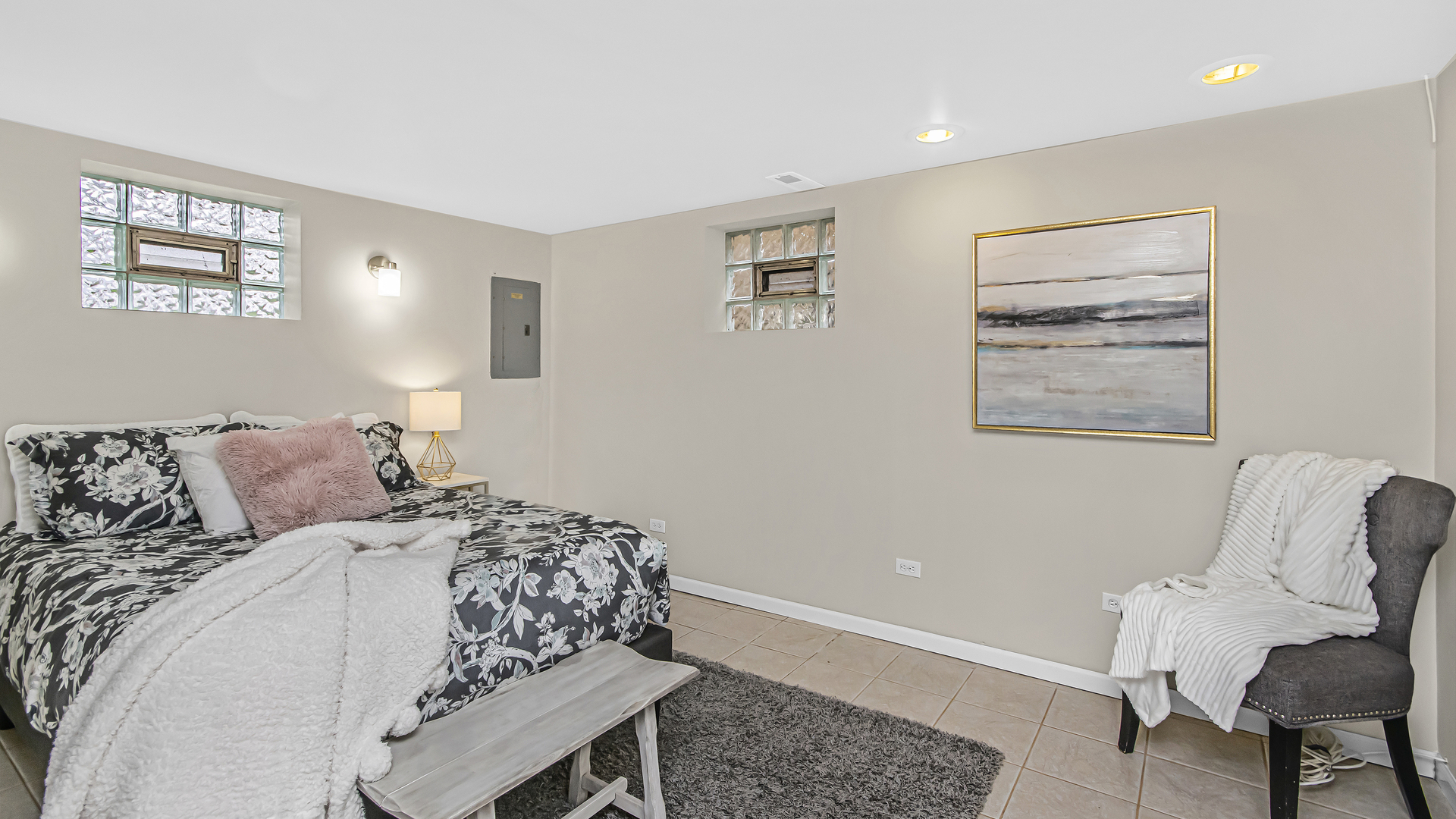 1622 Dempster Street Evanston, IL 60202 - Photo 15 of 21 a bedroom with a bed and a chair