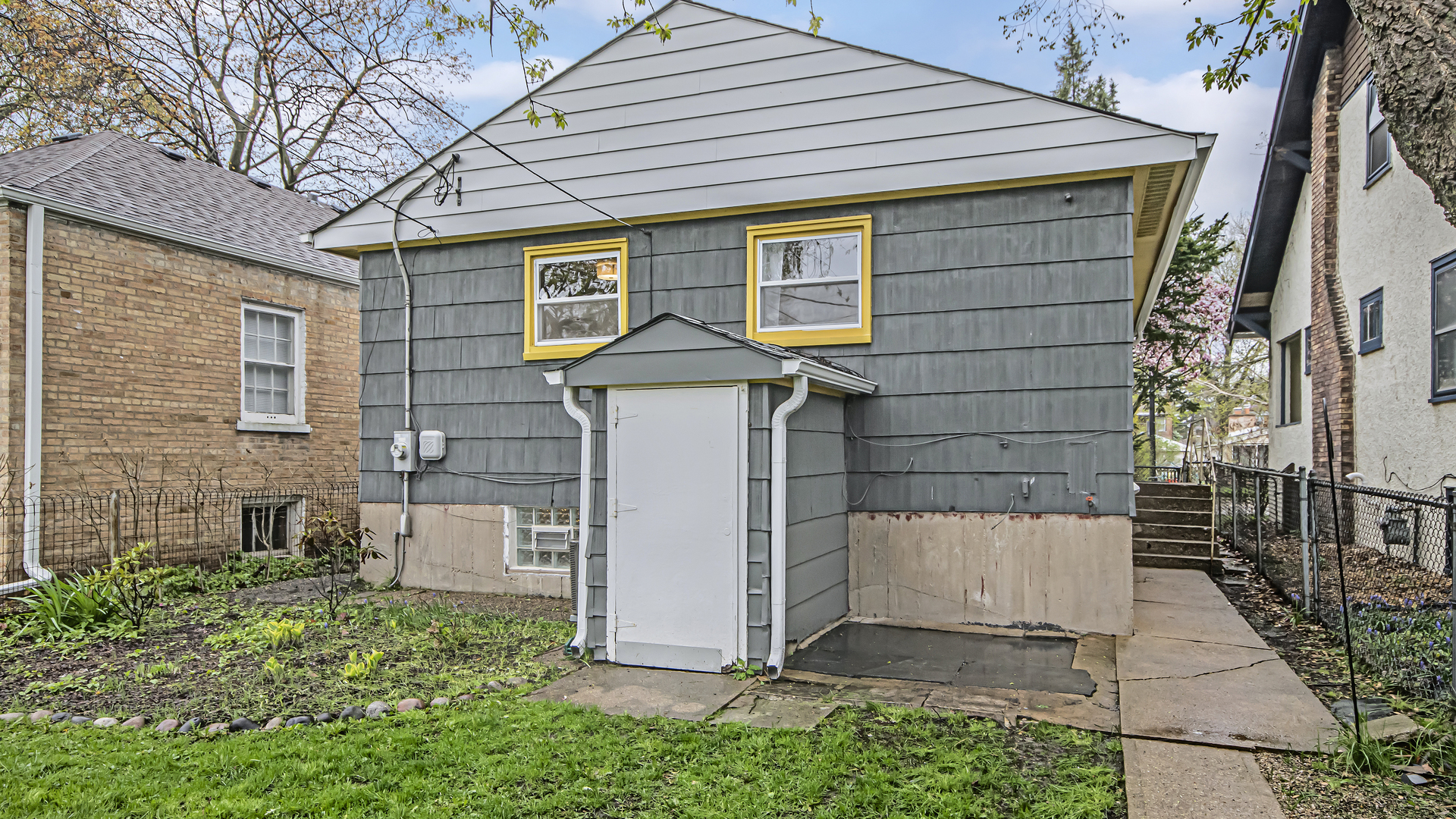 1622 Dempster Street Evanston, IL 60202 - Photo 20 of 21 a front view of a house with a yard