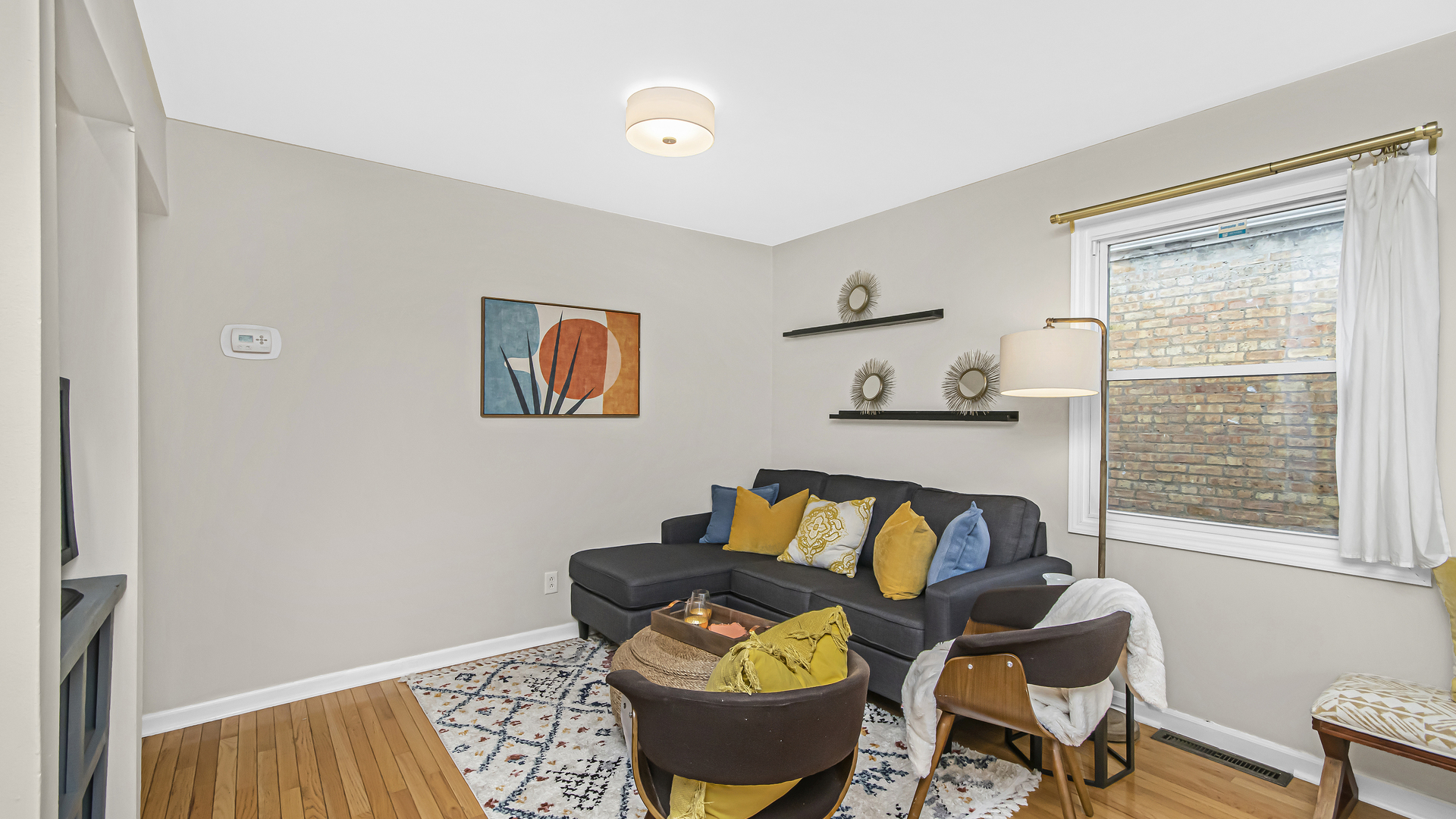 1622 Dempster Street Evanston, IL 60202 - Photo 2 of 21 a living room with furniture and a window