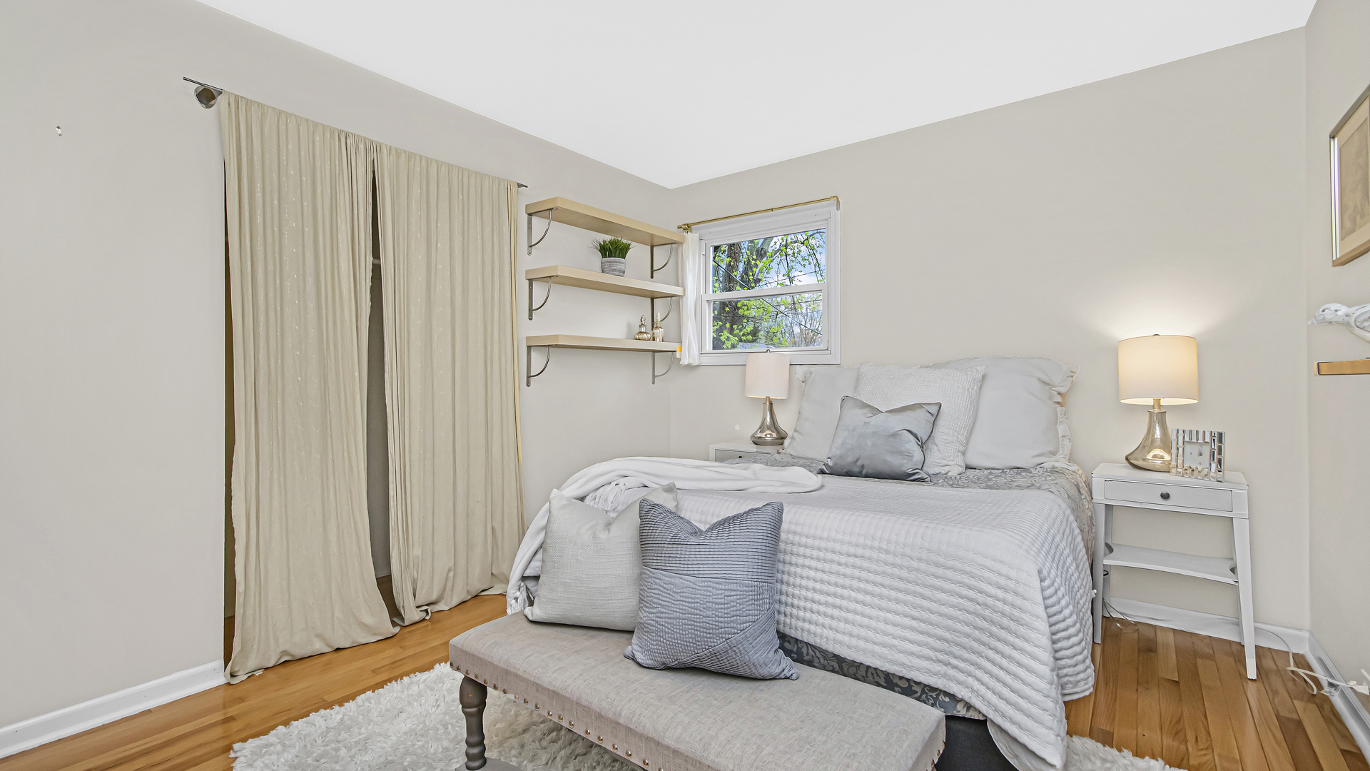 1622 Dempster Street Evanston, IL 60202 - Photo 10 of 21 a bedroom with a bed and a window