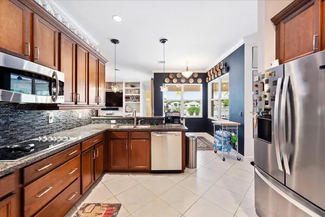 a bedroom with a bed a dresser and a flat screen tv