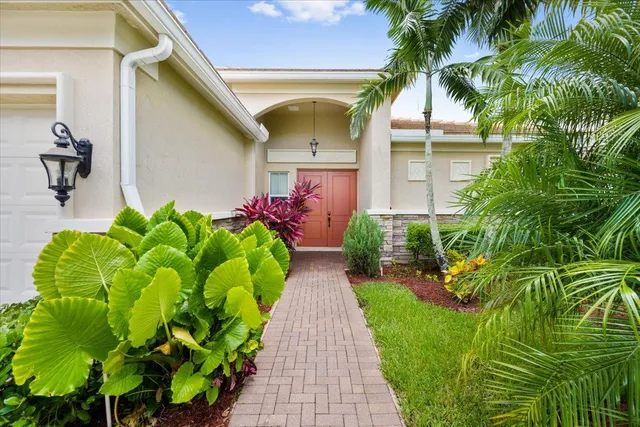 a bunch of flowers in front of house