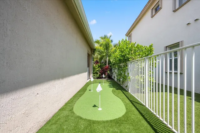 a view of a swimming pool with a yard