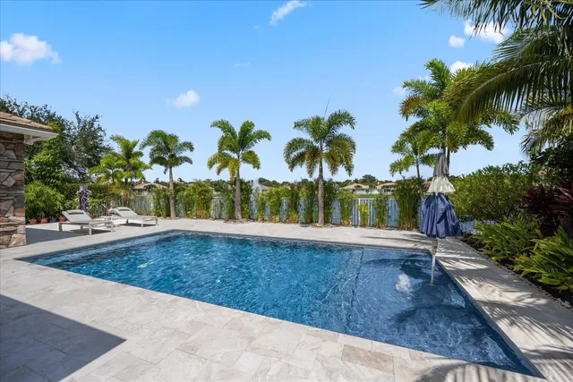 a view of a swimming pool with a patio