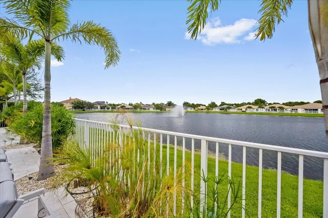 a view of a lake with houses in the background