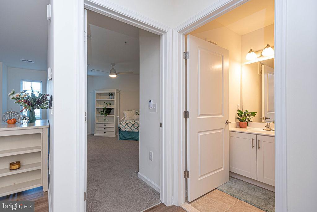 20141 Riesling Lane, Unit 106 Lewes, DE 19958 - Photo 21 of 31 a view of a hallway and dining room