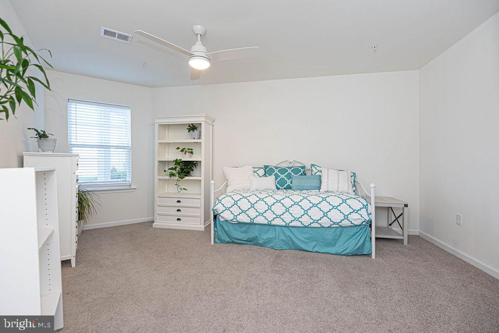 20141 Riesling Lane, Unit 106 Lewes, DE 19958 - Photo 22 of 31 a room with a bed and a view of room