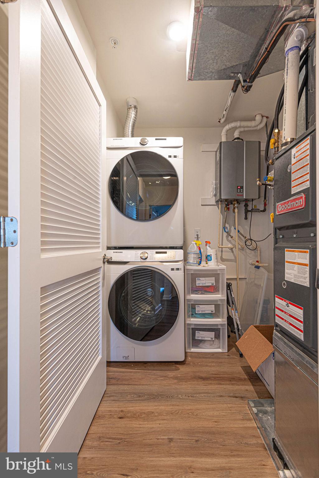 20141 Riesling Lane, Unit 106 Lewes, DE 19958 - Photo 27 of 31 a view of a hallway with washer and dryer