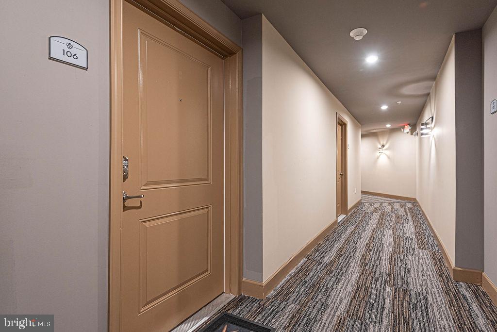 20141 Riesling Lane, Unit 106 Lewes, DE 19958 - Photo 6 of 31 a view of hallway with wooden floor