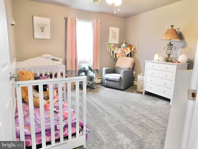 a bedroom with furniture and window