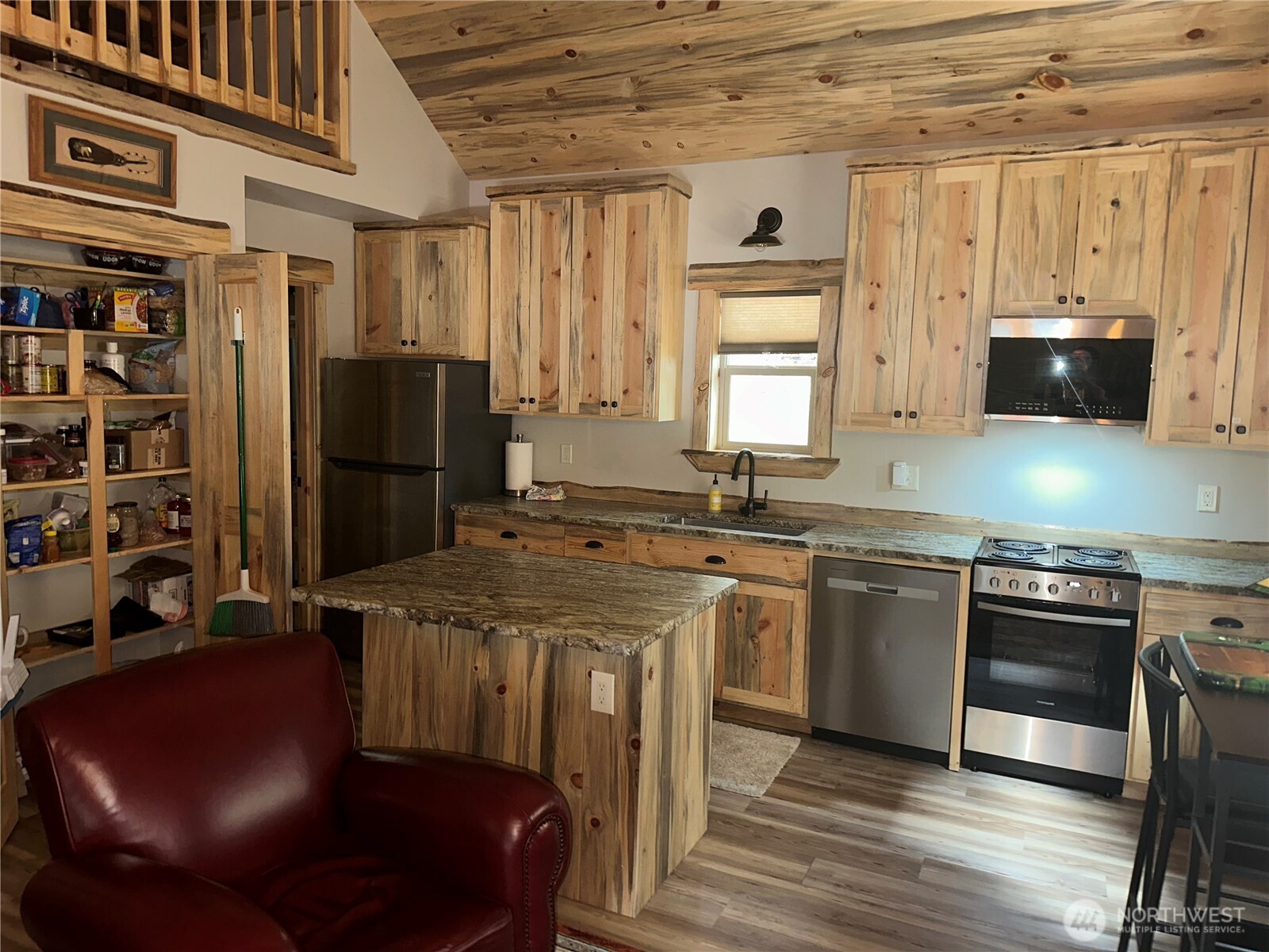 22415 Stirrup Road Leavenworth, WA 98826 - Photo 14 of 19 a kitchen with stainless steel appliances granite countertop a sink a stove and a refrigerator