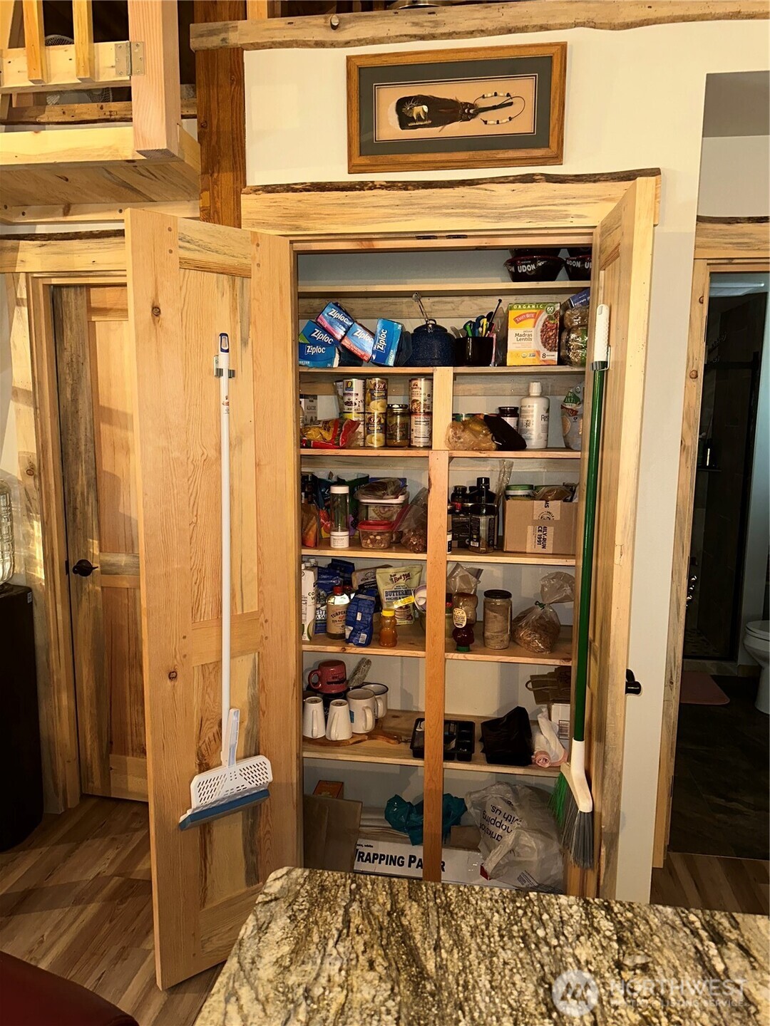22415 Stirrup Road Leavenworth, WA 98826 - Photo 16 of 19 a view of walk in closet with clothes and shoes