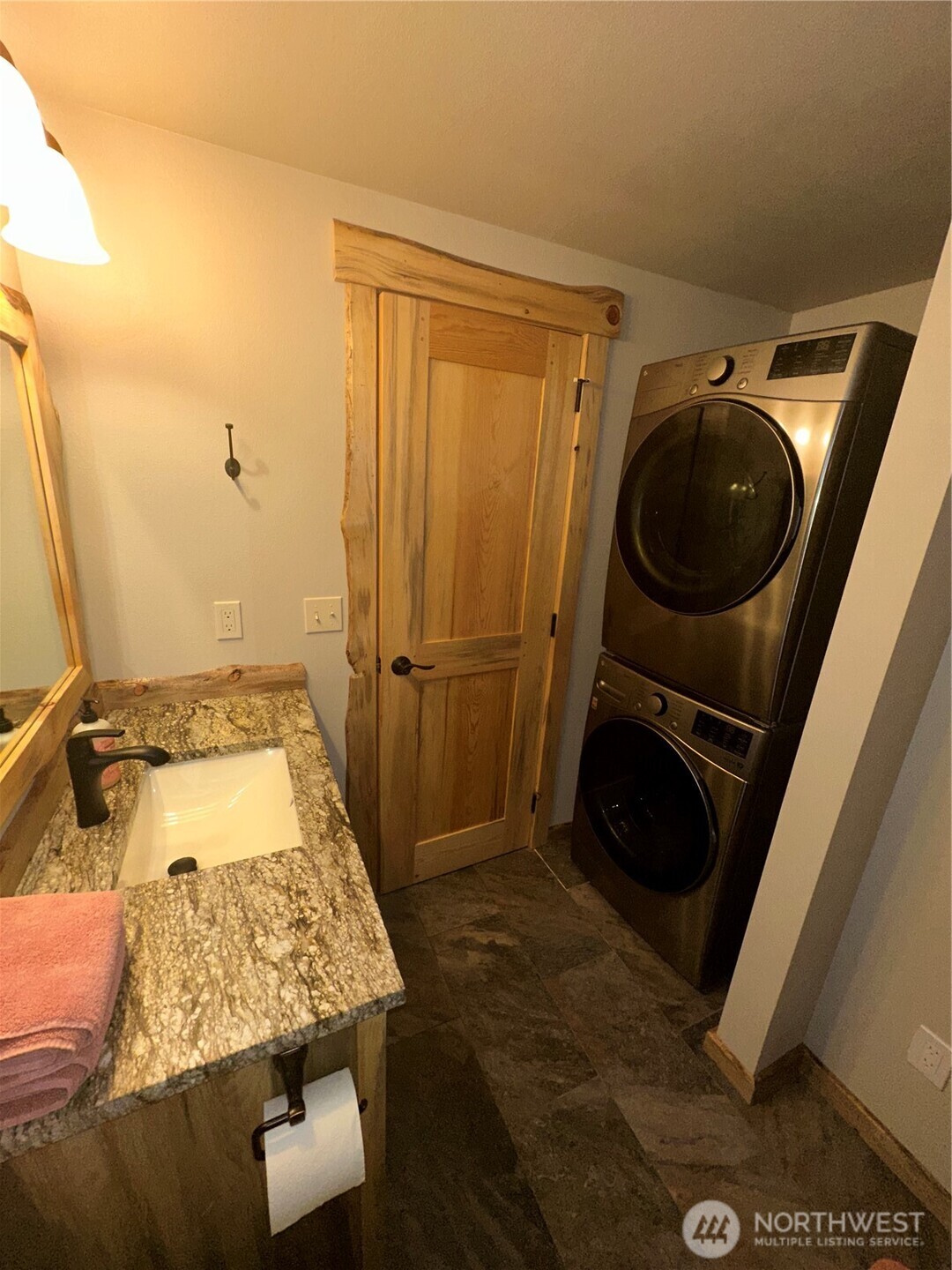 22415 Stirrup Road Leavenworth, WA 98826 - Photo 18 of 19 a bathroom with a granite countertop sink and a mirror