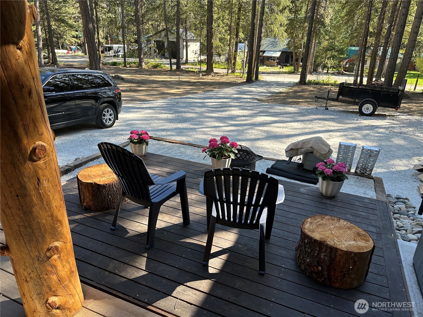 22415 Stirrup Road Leavenworth, WA 98826 - Photo 2 of 19 a outdoor space with patio the couches and a dining table with chairs