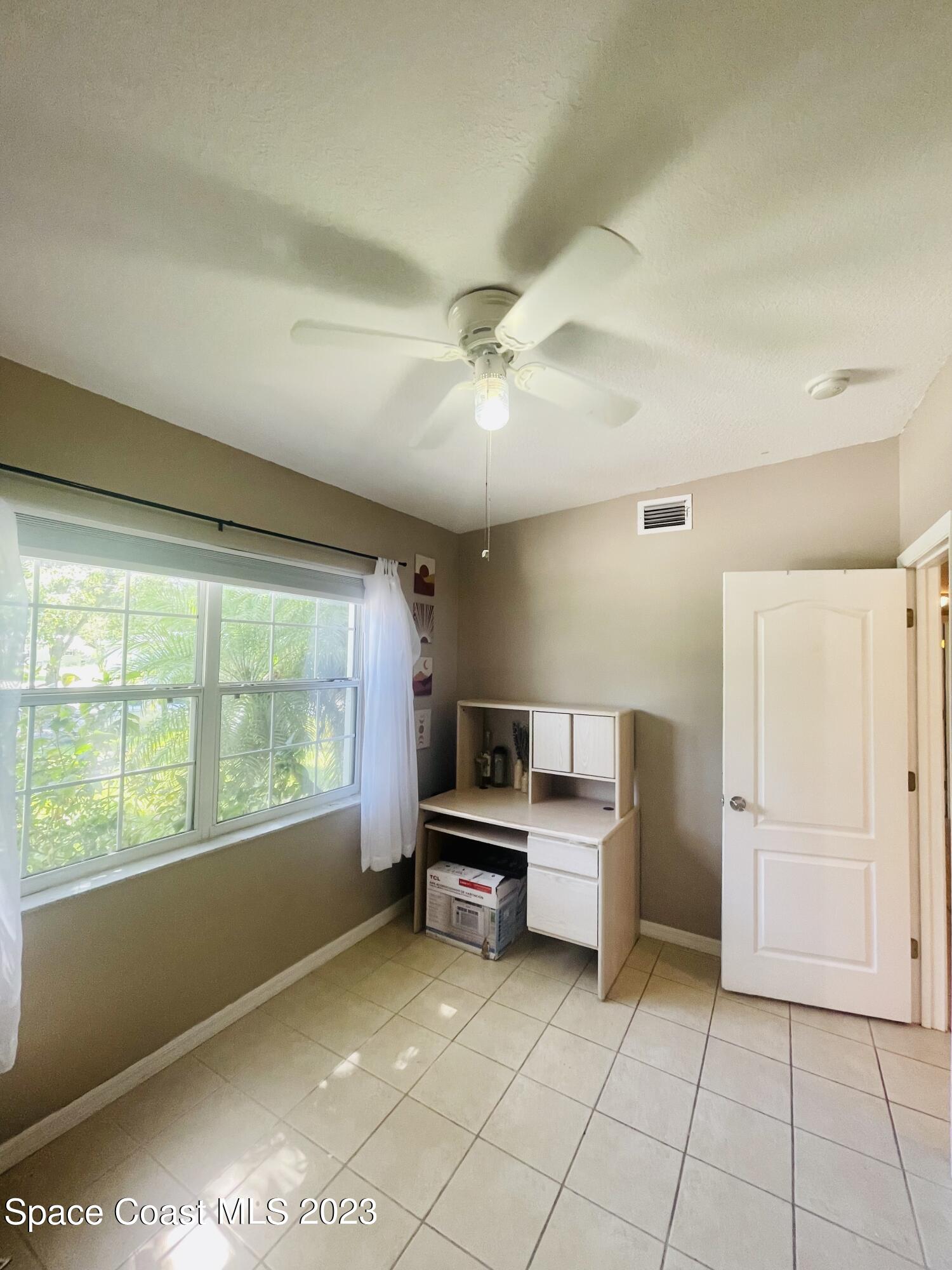 255 Lee Road Melbourne, FL 32904 - Photo 12 of 20 a living room with furniture and a open kitchen view