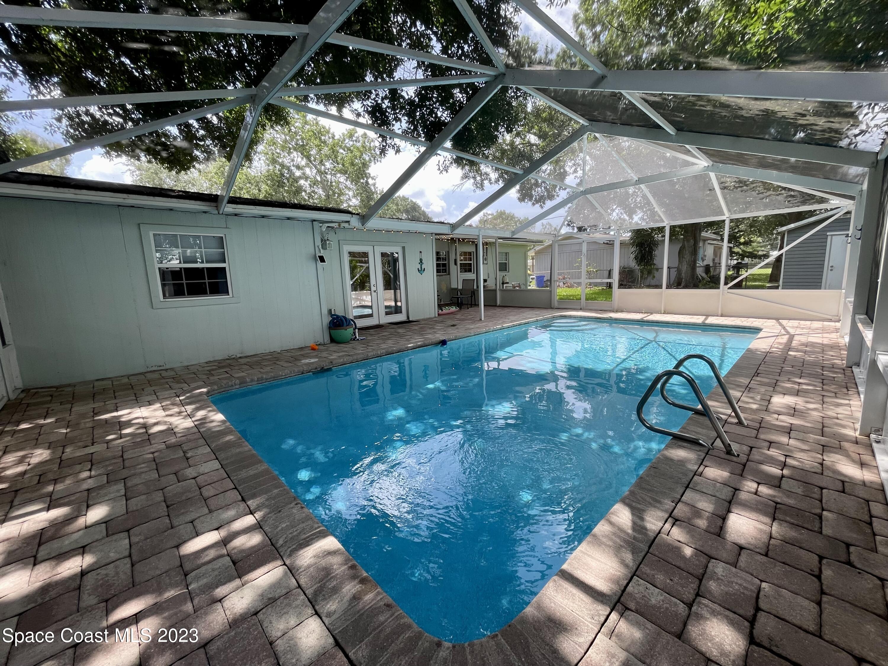 255 Lee Road Melbourne, FL 32904 - Photo 14 of 20 a view of swimming pool with seating space
