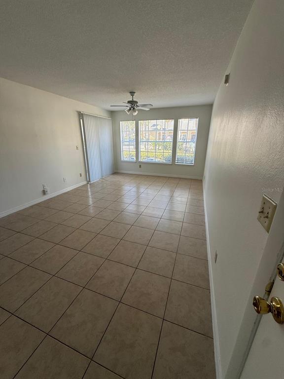 1057 South Hiawassee Road, Unit 1915 Orlando, FL 32835 - Photo 3 of 6 a view of an empty room and a window