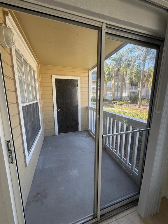 1057 South Hiawassee Road, Unit 1915 Orlando, FL 32835 - Photo 6 of 6 a view of a hallway with wooden floor and stairs