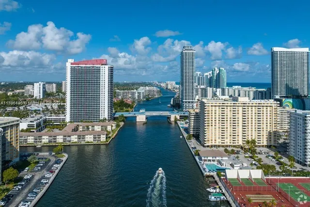 a view of residential houses with outdoor space