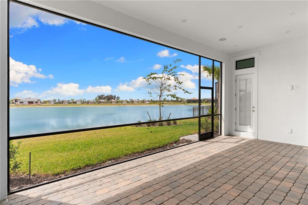 19084 Gentry Place Estero, FL 33928 - Photo 16 of 44 Screened lanai with pool bath, flat-panel TV prep, and space to add a custom pool