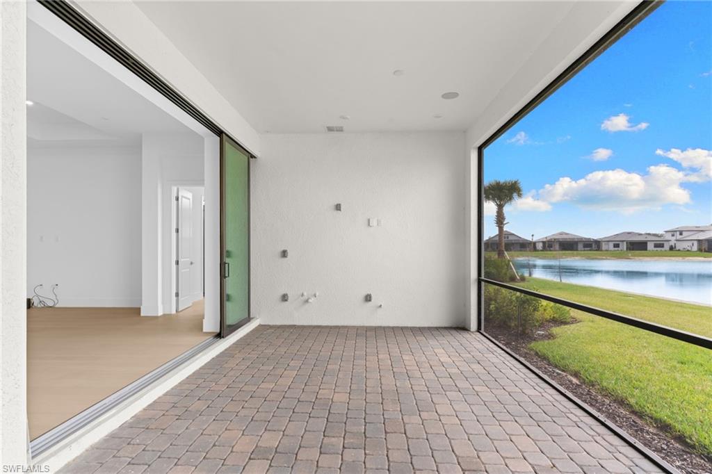 19084 Gentry Place Estero, FL 33928 - Photo 17 of 44 Screened lanai pre-plumbed for a future summer kitchen—envision your outdoor oasis with pool and BBQ.