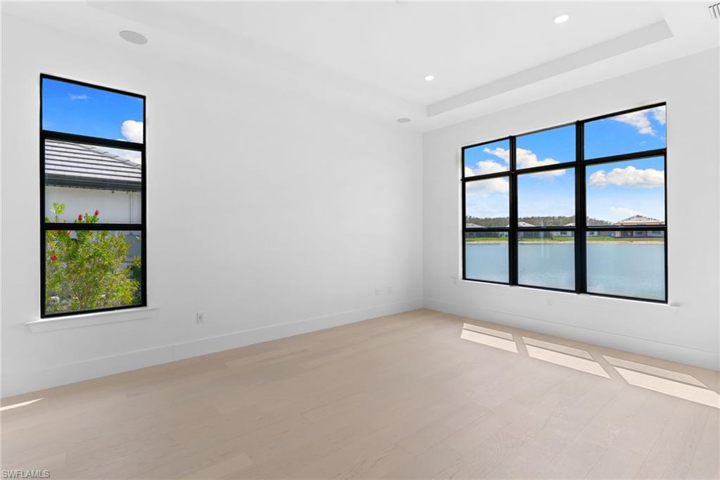 19084 Gentry Place Estero, FL 33928 - Photo 19 of 44 Primary Suite with Sunset West Views & Impact Windows