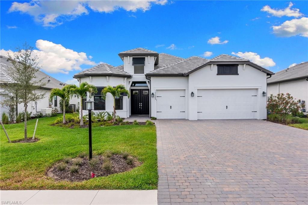 19084 Gentry Place Estero, FL 33928 - Photo 42 of 44 Popular Layton floor plan featuring a 3-car garage