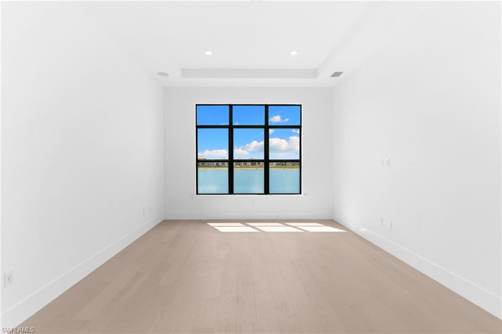 19084 Gentry Place Estero, FL 33928 - Photo 22 of 44 Primary Bedroom with Tray Ceiling