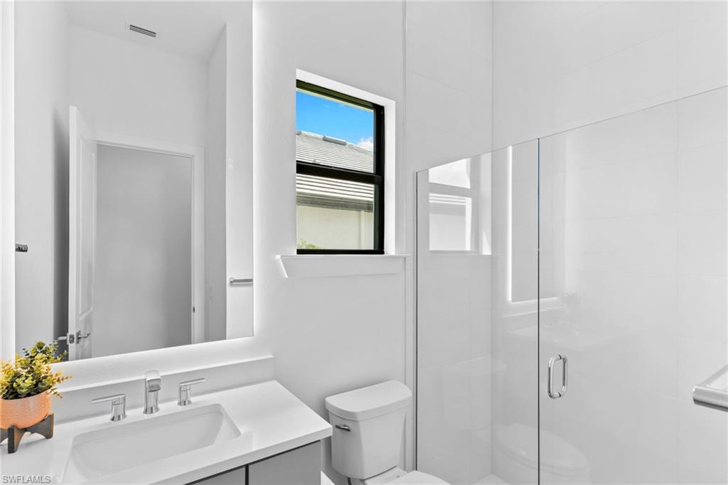 19084 Gentry Place Estero, FL 33928 - Photo 28 of 44 Full bathroom off front bedroom with Silestone countertops