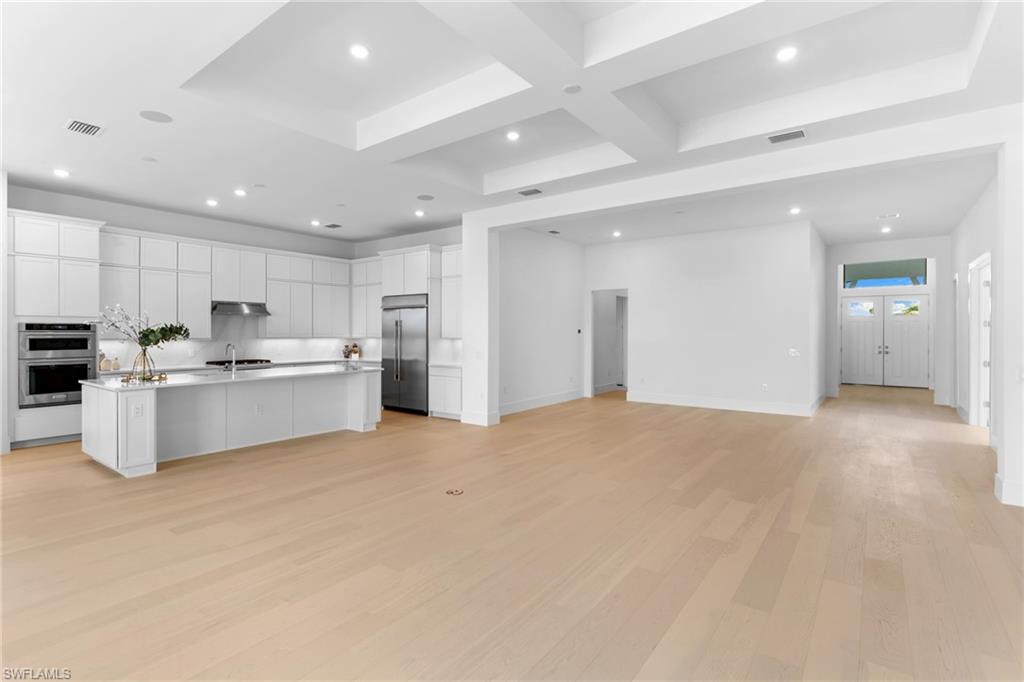 19084 Gentry Place Estero, FL 33928 - Photo 3 of 44 Elegant tray ceiling living room with open-concept flow