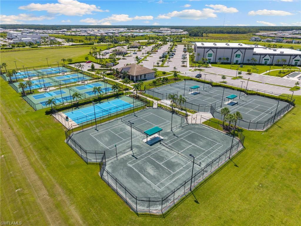 19084 Gentry Place Estero, FL 33928 - Photo 41 of 44 Outdoors, you’ll enjoy 12 Pickleball Courts, 5 Tennis Courts, a Practice Court with a ball machine, and additional Pro Shop.