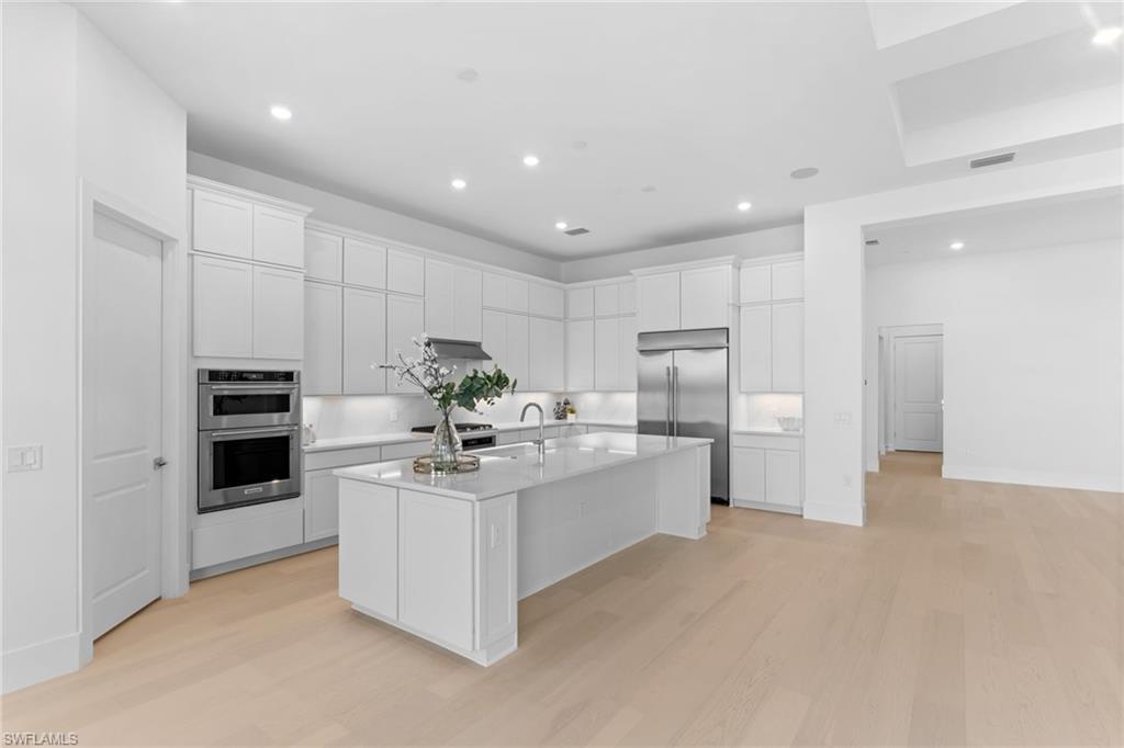 19084 Gentry Place Estero, FL 33928 - Photo 7 of 44 Kitchen features walk-in pantry, recessed lighting, and under-cabinet lighting