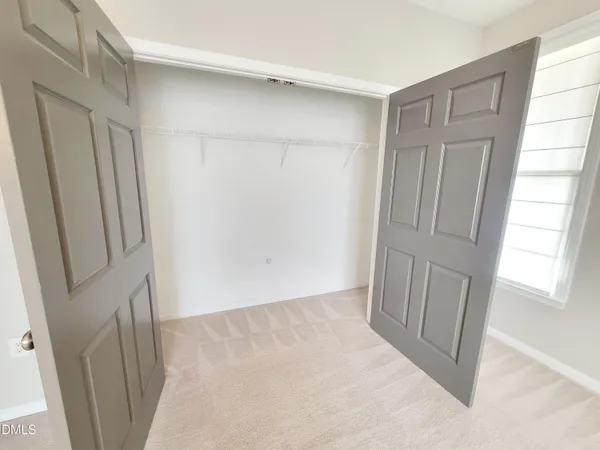 a bathroom with a granite countertop sink and a large mirror