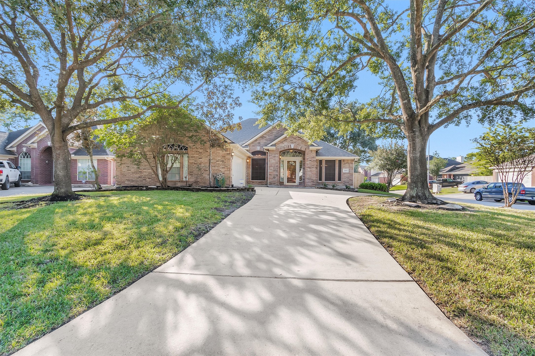 2615 Honeysuckle Walk Spring, TX 77388 - Photo 2 of 39 a front view of a house with a yard and trees